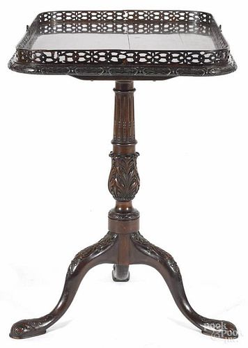 George III style carved mahogany tea table, ca. 1900, with a pierced gallery top