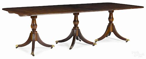 Regency style mahogany triple-pedestal dining table, early 20th c., 29 3/4'' h., 47'' w., 68'' d.