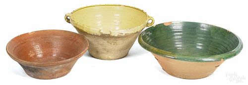 Four assorted pottery bowls, largest - 27'' dia.