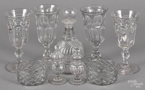 Colorless glass, to include four celery vases, a decanter, two cruets, and two wine coasters.