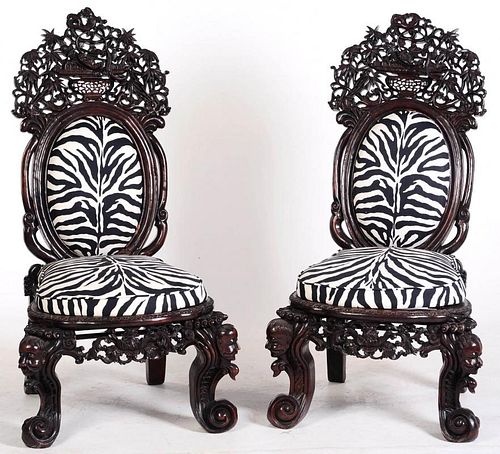 AN EXTRAORDINARY PAIR OF ANGLO CHINESE CARVED CHAIRS