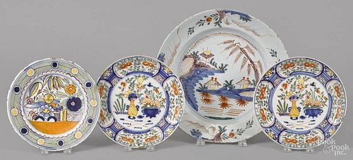 Delft polychrome decorated charger, 18th c., 13 5/8'' dia., together with three plates.