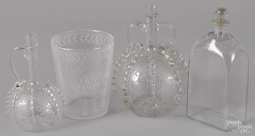Four Continental colorless glass vessels, 19th c., to include two etched bottles
