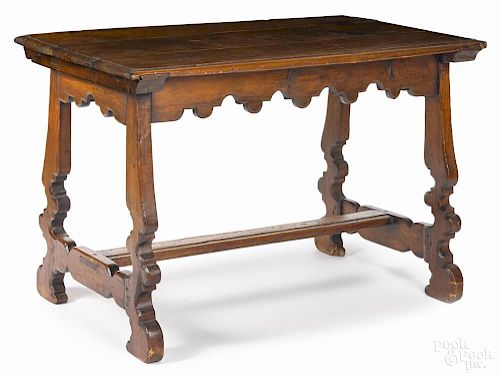 Spanish baroque style pine table with a scalloped apron and legs, 30'' h., 45 1/2'' w., 26'' d.