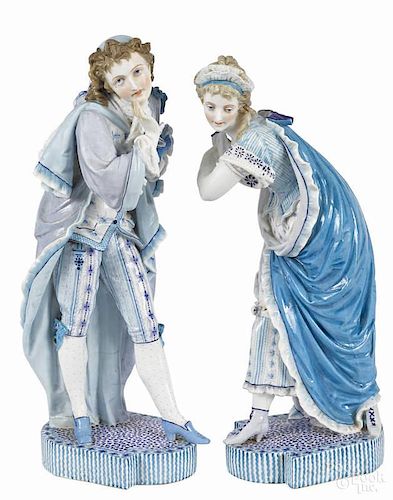 Pair of Vion & Baury porcelain figures of a young man and woman, ca. 1900, in blue dress