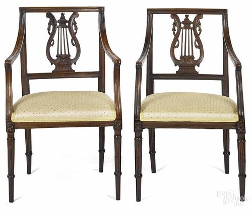 Pair of French Directoire fruitwood armchairs, early 19th c.
