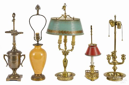 French boulotte lamp, together with three other assorted brass lamps and a pottery lamp.