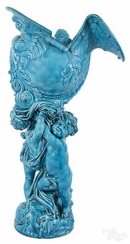 Sevres glazed pottery jardinière of two putti holding a helmet, molded by Charles Ficquenet
