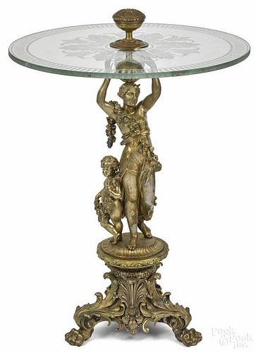 French bronze figural center table, late 19th c., with an etched glass top, 34'' h., 24'' w.