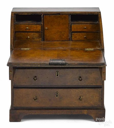 George III burled walnut child's slant front desk, late 18th c., with a fitted interior