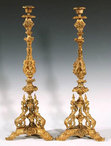 A PAIR OF BAROQUE STYLE BRONZE ALTAR CANDLESTICKS