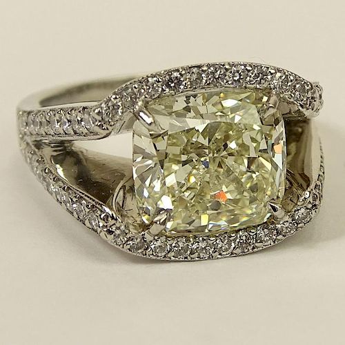 Important Approx. 7.01 Carat Cushion Cut Diamond and Platinum Ring accented with Micro Pave Set Diamonds Throughout.