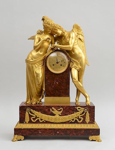 CHARLES X ORMOLU AND ROUGE ROYALE MARBLE FIGURAL CLOCK