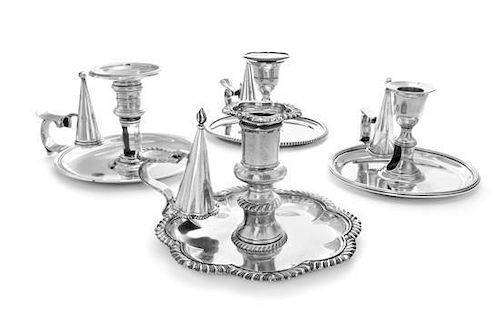 * A Group of Silver Chambersticks, Various Makers, comprising a circular example engraved with a crest depicting a bird on rocke