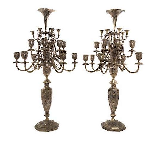 * A Pair of Persian Silver Eighteen-Light Candelabra, Iran, Probably Mid-20th Century, each topped with a trumpet vase centering