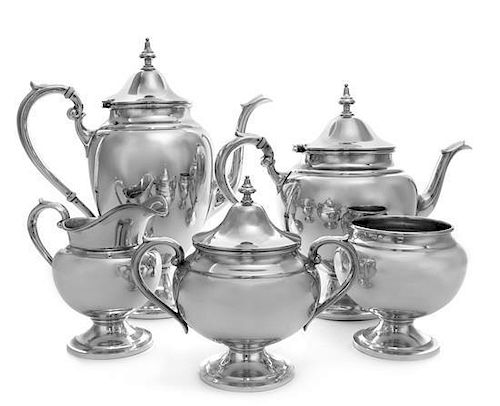 An American Silver Coffee and Tea Service, Gorham Mfg. Co., Providence, RI, in the Puritan pattern, comprising a coffee pot, a t