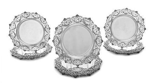 * A Set of Twelve English Silver Plates , Elkington & Co., London, 1910 , each having pierced foliate scroll borders.