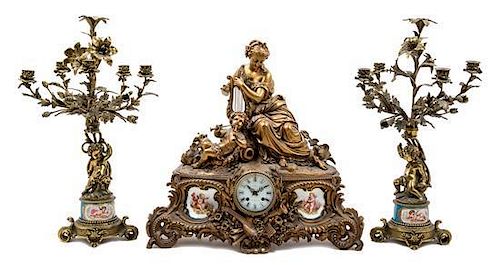 * A Louis XV Style Gilt Metal and Sevres Style Porcelain Garniture Height of candelabra 26 1/2 inches.