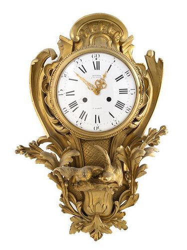 * A Louis XV Style Gilt Bronze Cartel Clock Height 20 inches.