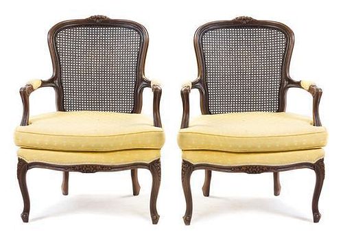 A Pair of Louis XV Style Walnut Fauteuils Height 37 inches.