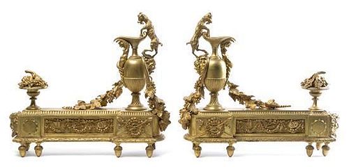 A Pair of Louis XVI Style Gilt Bronze Chenets Height 18 x width 19 inches.