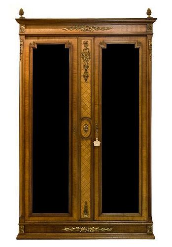 A Louis XVI Style Gilt Bronze Mounted Parquetry Decorated Armoire Height 87 x width 56 x depth 21 1/2 inches.