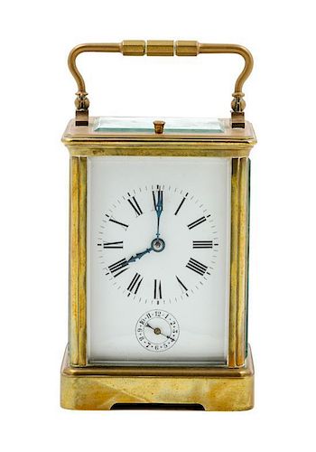 * A French Gilt Bronze Carriage Clock Height 5 3/4 inches.