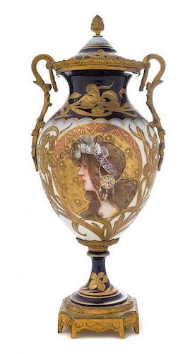 * A Sevres Style Gilt Bronze Mounted Porcelain Urn Height 17 inches.