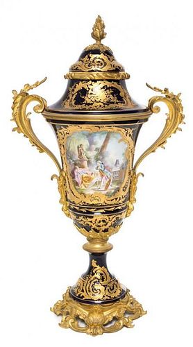* A Sevres Gilt Bronze Mounted Porcelain Urn Height 26 1/4 inches.