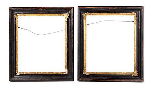 A Pair of Continental Black Painted and Parcel Gilt Frames Height 17 x width 15 inches.