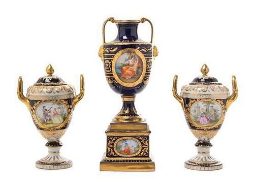 * Three Royal Vienna Porcelain Twin-Handled Urns Height of tallest 9 inches.