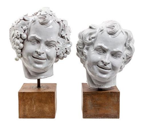 * Two White Glazed Terra Cotta Heads of Bacchus Height of first 16 1/2 inches.