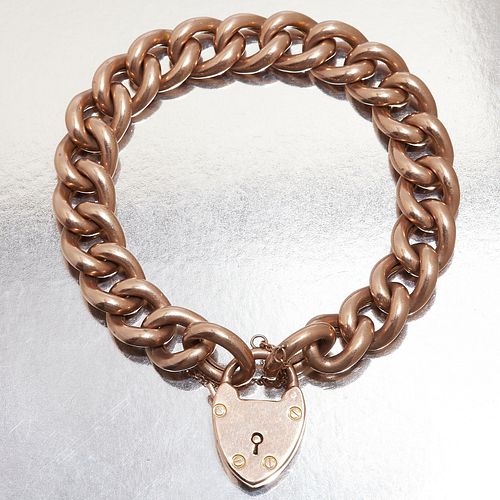 CURB LINK BRACELET WITH A HEART PADLOCK CLASP
