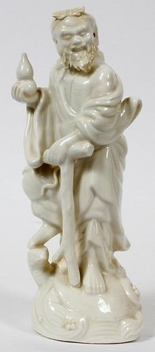 CHINESE PORCELAIN FIGURE OF A DEITY