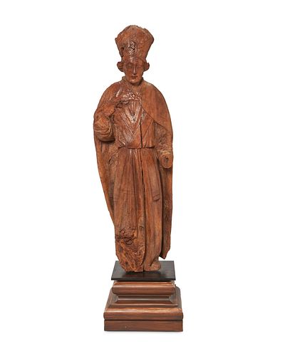 A Continental carved wood cardinal figure