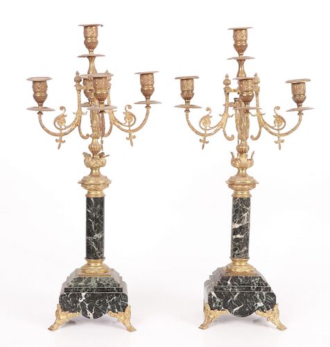 A pair of French gilt bronze and marble candelabra
