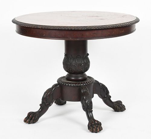 A Classical style carved mahogany center table