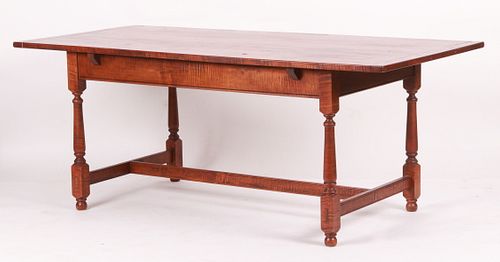 A William and Mary style tiger maple dining table