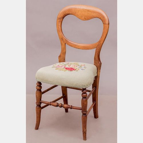 A Victorian Walnut Side Chair with Needlework Seat, 19th Century.