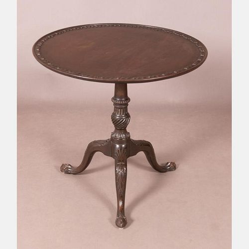 A Chippendale Heavily Carved Mahogany Tilt Top Tea Table, 18th Century.