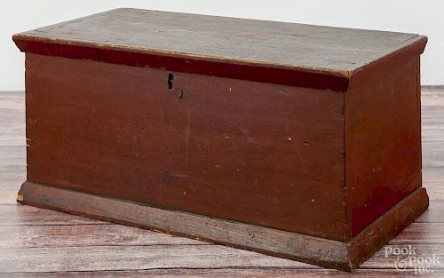 Pennsylvania painted pine valuables box, ca. 1840, retaining an old red surface, 10 3/4'' h., 22'' w.
