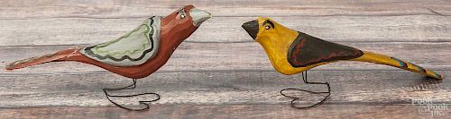 Daniel Strawser, two carved and painted birds, initialed and dated '86, on wire heart-form bases