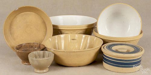 Eight pieces of yelloware, ca. 1900, to include a nest of three English bowls, three food molds