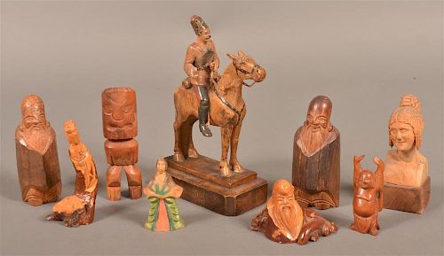 Nine various figural wood carvings.