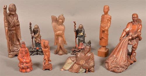 Nine Carved Wood Oriental Figures.