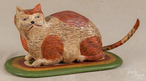 Walter Gottshall, carved and painted figure of a cat on a rug, initialed and dated '88, 5'' h.
