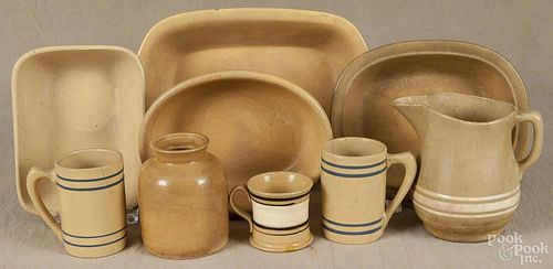 Nine pieces of yelloware, 19th c. to include four serving bowls, a pitcher, three mugs