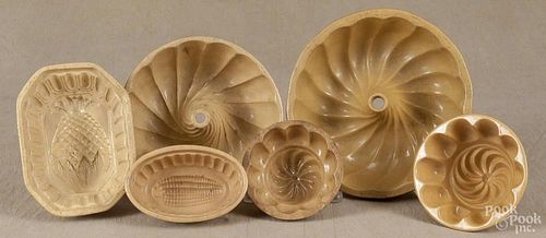 Seven yelloware food molds, 19th c., largest - 8 1/2'' dia.