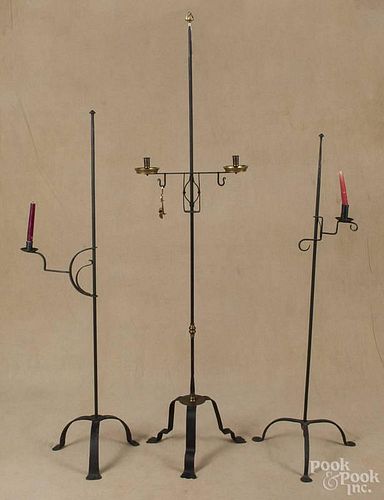 Three contemporary wrought iron floor candlestands, tallest - 69 1/2''.