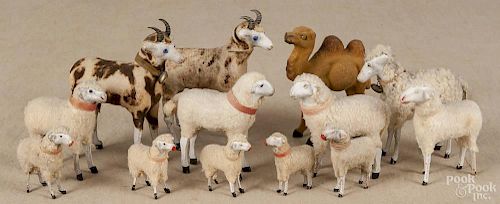 Twelve stick leg sheep, ca. 1900, together with a stick leg camel, tallest - 5''.